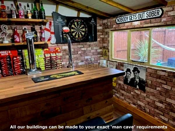 A man cave bar with a dartboard, beer taps, and a window.