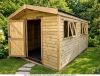 A large wooden shed with an open door and windows.