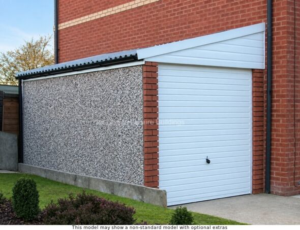 Lidget Pent Lean-To Concrete Garages With Free Installation. Image Shown Includes Non-Standard Options A garage building made in Britain with a white door and a brick wall designed to joint an existing house. The building has a grey textured side and a black roof