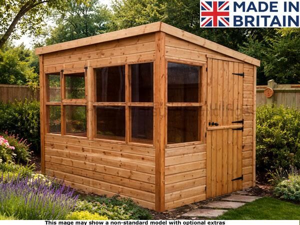 Diamond Portslade Shed 1 A wooden potting shed with large windows and a door, set amidst a garden.