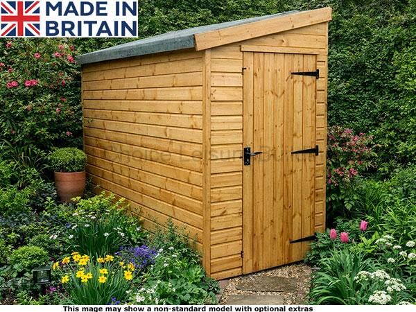 Shoreham Narrow Sheds 1 A wooden garden shed with a grey roof and black hardware, surrounded by flowers and plants. The shed is made of light-coloured wood.