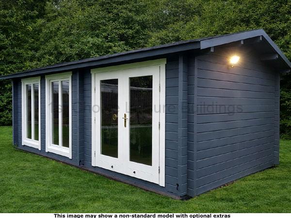 Shalford Apex Cabin 1 Garden log cabin with dark blue cladding and white doors and windows. A light on the exterior wall is turned on.