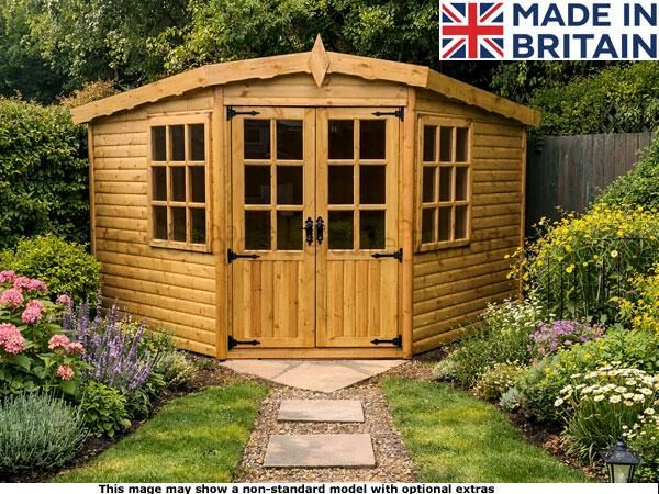 A wooden garden shed with double doors and windows, surrounded by a beautiful garden.
