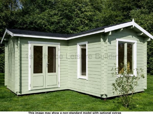 Pyrford L Shaped Cabin 1 Image of a green wooden garden log cabin. The shed has a black roof and white trim.