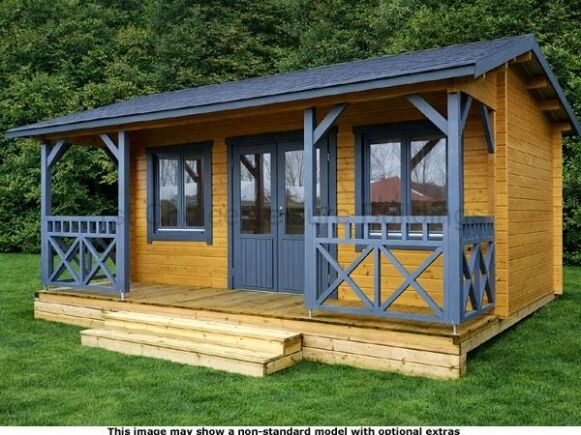 Shere Apex Cabin 1 A wooden garden log cabin with blue trim and porch, set in a grassy area.