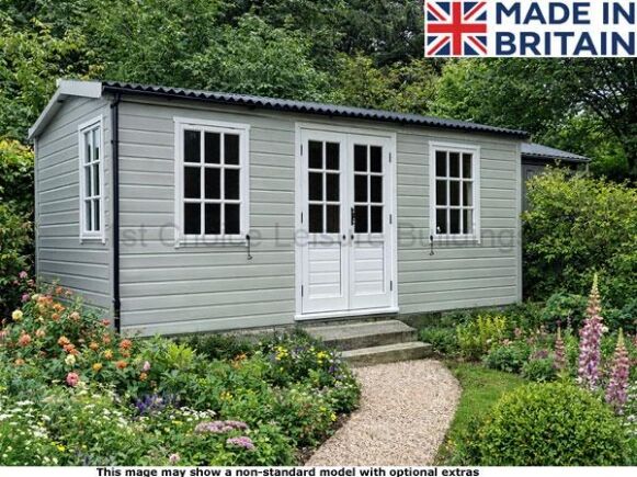 Platinum Winchester Apex 1 A small grey garden building with white trim and doors. The building has a garden path leading to it.