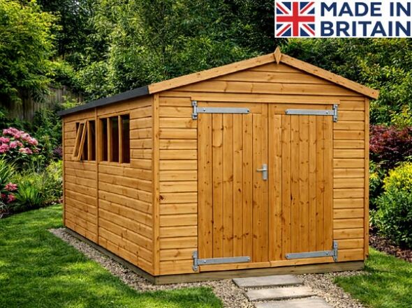 Timber garden workshop with double doors and Georgian-style windows.
