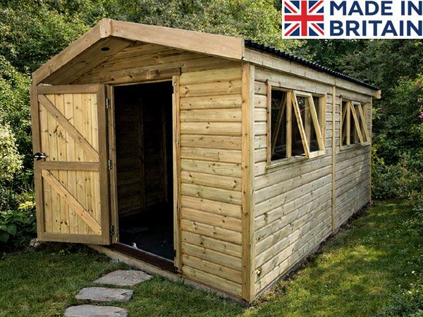 A large wooden shed with an open door and windows.